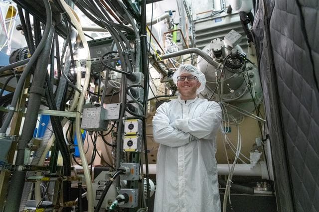 OCI Technician Monitors the Thermal Vacuum Chamber
