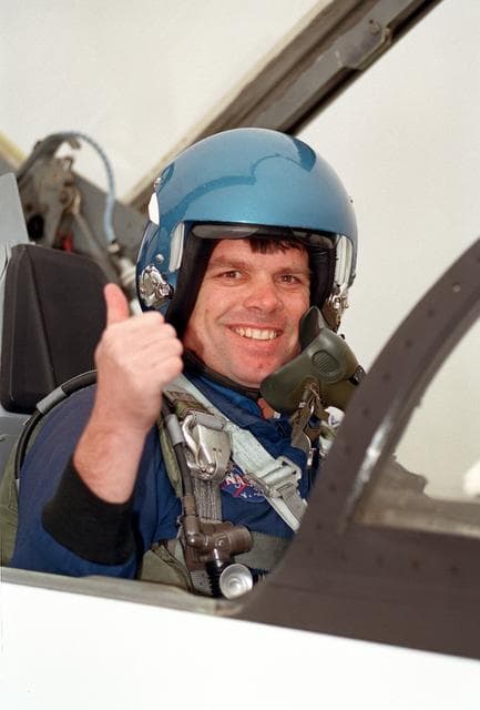 NASA image: STS-99 crewmembers in aircraft prior to leaving Ellington Field for KSC