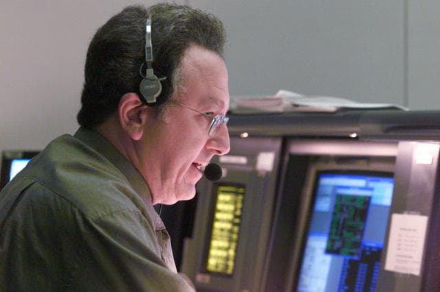 NASA image: Various views of personnel in MCC during STS-106