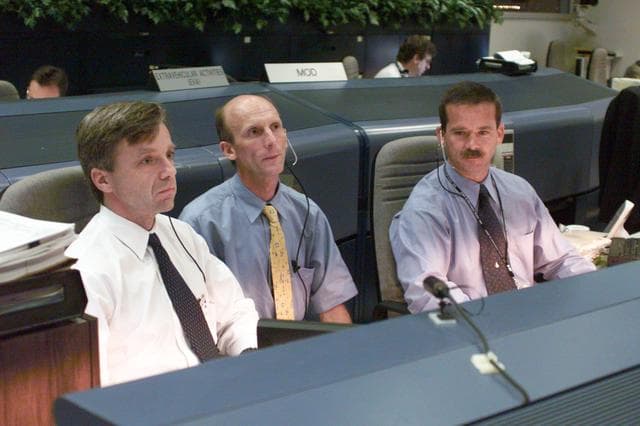 NASA image: Various views of personnel in MCC during STS-106