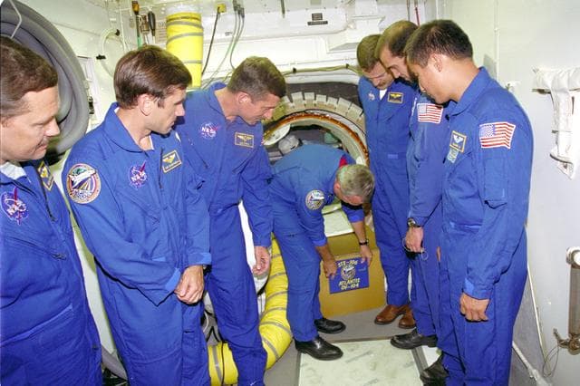 NASA image: STS-106 CMDR. TERRENCE W. WILCUTT BENDS TO PLACE THE STS-106 MIS