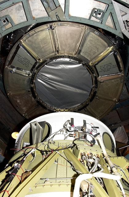 NASA image: KENNEDY SPACE CENTER, FLA. -  On Launch Complex 17-B, Cape Canaveral Air Force Station, the Space Infrared Telescope Facility (SIRTF) observatory is being dismantled  from atop the Delta II rocket.  It will be taken back to NASA Spacecraft Hangar AE. SIRTF will remain in the clean room at Hangar AE until it returns to the pad in early August.
