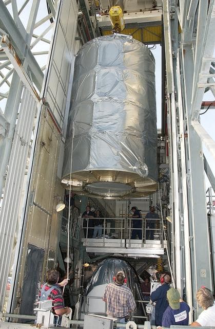 NASA image: KENNEDY SPACE CENTER, FLA. - On Launch Complex 17-B, Cape Canaveral Air Force Station, the Space Infrared Telescope Facility (SIRTF) observatory is moved toward the outside of the launch tower.  It will be lowered and taken back to NASA Spacecraft Hangar AE. SIRTF will remain in the clean room at Hangar AE until it returns to the pad in early August.