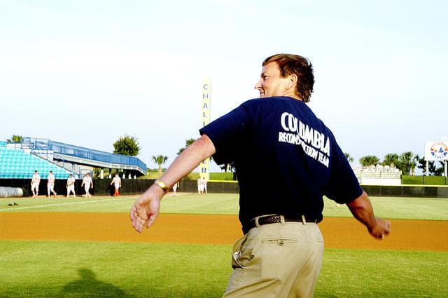NASA image: KENNEDY SPACE CENTER, FLA. - Shuttle Launch Director Mike Leinbach throws out the first pitch at a local baseball game at Manatees Stadium.  KSC employees were hosted by the Brevard Manatees, a minor league baseball team in Central Florida.   Before the game, attendees offered a moment of silence to honor the STS-107 crew and two recovery workers who died in a helicopter crash.