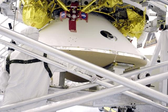 NASA image: KENNEDY SPACE CENTER, FLA. - In the  Payload Hazardous Servicing Facility, the cruise stage is mated to the Mars Exploration Rover 2 (MER-2) entry vehicle.    The cruise stage includes fuel tanks, thruster clusters and avionics for steering and propulsion.  NASA's twin Mars Exploration Rovers are designed to study the history of water on Mars. These robotic geologists are equipped with a robotic arm, a drilling tool, three spectrometers, and four pairs of cameras that allow them to have a human-like, 3D view of the terrain. Each rover could travel as far as 100 meters in one day to act as Mars scientists' eyes and hands, exploring an environment where humans can't yet go.  MER-2 is scheduled to launch June 5 as MER-A aboard a Delta rocket from Cape Canaveral Air Force Station.