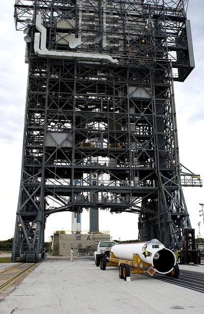 NASA image: KENNEDY SPACE CENTER, FLA. - A solid rocket booster arrives at Launch Complex 17-A, Cape Canaveral Air Force Station.  It is one of nine that will be mated to the Delta rocket to launch Mars Exploration Rover 2. NASA’s twin Mars Exploration Rovers are designed to study the history of water on Mars. These robotic geologists are equipped with a robotic arm, a drilling tool, three spectrometers, and four pairs of cameras that allow them to have a human-like, 3D view of the terrain. Each rover could travel as far as 100 meters in one day to act as Mars scientists' eyes and hands, exploring an environment where humans can’t yet go.  MER-2 is scheduled to launch June 5 as MER-A.  MER-1 (MER-B) will launch June 25.