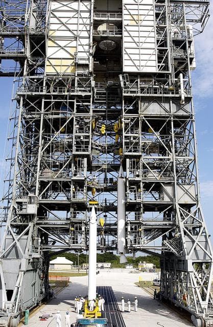 NASA image: KENNEDY SPACE CENTER, FLA. -  A second solid rocket booster (SRB) is ready to be lifted up the launch tower  on Launch Complex 17-A, Cape Canaveral Air Force Station.  They are two of nine SRBs that will be mated to the Delta rocket to launch Mars Exploration Rover 2. NASA’s twin Mars Exploration Rovers are designed to study the history of water on Mars. These robotic geologists are equipped with a robotic arm, a drilling tool, three spectrometers, and four pairs of cameras that allow them to have a human-like, 3D view of the terrain. Each rover could travel as far as 100 meters in one day to act as Mars scientists' eyes and hands, exploring an environment where humans can’t yet go.  MER-2 is scheduled to launch June 5 as MER-A.  MER-1 (MER-B) will launch June 25.