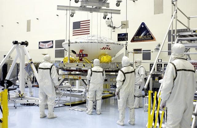 NASA image: KENNEDY SPACE CENTER, FLA. -  In the Payload Hazardous Servicing Facility, an overhead crane is lifting the Mars Exploration Rover 2 (MER-2) to move it to a spin table.  NASA’s twin Mars Exploration Rovers are designed to study the history of water on Mars. These robotic geologists are equipped with a robotic arm, a drilling tool, three spectrometers, and four pairs of cameras that allow them to have a human-like, 3D view of the terrain. Each rover could travel as far as 100 meters in one day to act as Mars scientists' eyes and hands, exploring an environment where humans can’t yet go.  The MER-2 is scheduled to launch June 5 from Launch Pad 17-A, Cape Canaveral Air Force Station.