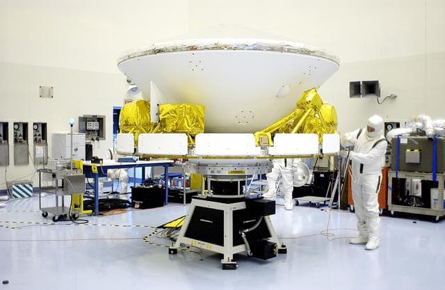 NASA image: KENNEDY SPACE CENTER, FLA. -  The Mars Exploration Rover 2 (MER-2) is ready for a second spin test in the Payload Hazardous Servicing Facility.  After mating to the third stage of the Delta II rocket, MER-2 will be transported to the launch pad.  NASA’s twin Mars Exploration Rovers are designed to study the history of water on Mars. These robotic geologists are equipped with a robotic arm, a drilling tool, three spectrometers, and four pairs of cameras that allow them to have a human-like, 3D view of the terrain. Each rover could travel as far as 100 meters in one day to act as Mars scientists' eyes and hands, exploring an environment where humans can’t yet go.  The MER-2 is scheduled to launch June 5 from Launch Pad 17-A, Cape Canaveral Air Force Station.