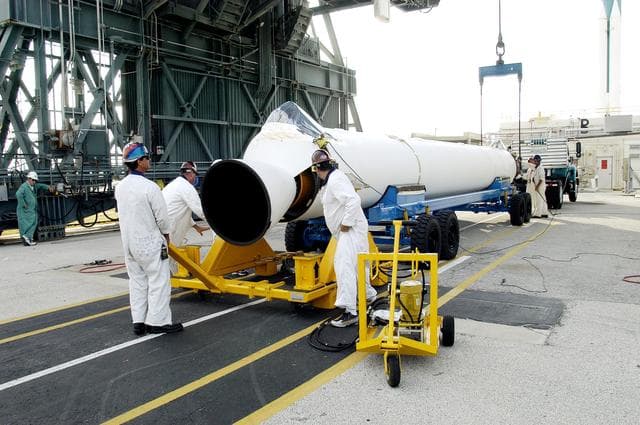 NASA image: KENNEDY SPACE CENTER, FLA. -   A solid rocket booster arrives at Launch Complex 17-B, Cape Canaveral Air Force Station, to be mated to the Delta II rocket for the Mars Exploration Rover 1 (MER-1) launch June 25.  NASA’s twin Mars Exploration Rovers are designed to study the history of water on Mars. These robotic geologists are equipped with a robotic arm, a drilling tool, three spectrometers, and four pairs of cameras that allow them to have a human-like, 3D view of the terrain. Each rover could travel as far as 100 meters in one day to act as Mars scientists' eyes and hands, exploring an environment where humans can’t yet go.  MER-2 (MER-A) will launch June 5.