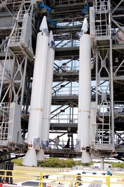 NASA image: KENNEDY SPACE CENTER, FLA. - Three solid rocket boosters are suspended in the launch tower of Launch Complex 17-B, Cape Canaveral Air Force Station.   They will be mated to the Delta II rocket for the Mars Exploration Rover 1 (MER-1) launch June 25.  NASA’s twin Mars Exploration Rovers are designed to study the history of water on Mars. These robotic geologists are equipped with a robotic arm, a drilling tool, three spectrometers, and four pairs of cameras that allow them to have a human-like, 3D view of the terrain. Each rover could travel as far as 100 meters in one day to act as Mars scientists' eyes and hands, exploring an environment where humans can’t yet go.  MER-2 (MER-A) will launch June 5.