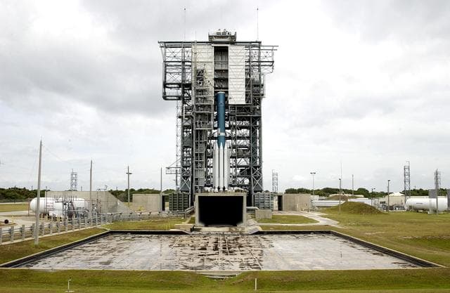NASA image: KENNEDY SPACE CENTER, FLA. -  Erection of the Delta II rocket for the Mars Exploration Rover 1 (MER-1) launch on June 25 at Launch Complex 17-B, Cape Canaveral Air Force Station, is under way.  NASA’s twin Mars Exploration Rovers are designed to study the history of water on Mars. These robotic geologists are equipped with a robotic arm, a drilling tool, three spectrometers, and four pairs of cameras that allow them to have a human-like, 3D view of the terrain. Each rover could travel as far as 100 meters in one day to act as Mars scientists' eyes and hands, exploring an environment where humans can’t yet go.  MER-2 (MER-A) will launch June 5.