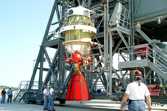 NASA image: KENNEDY SPACE CENTER, FLA. - The second stage of a Delta II rocket is raised to a vertical position and prepared for its lift up the launch tower on Pad 17-B, Cape Canaveral Air Force Station.  It will be mated to the Delta first stage already at the pad in preparation for the launch of the Mars Exploration Rover-1 (MER-B) on June 25.  NASA’s twin Mars Exploration Rovers are designed to study the history of water on Mars. These robotic geologists are equipped with a robotic arm, a drilling tool, three spectrometers, and four pairs of cameras that allow them to have a human-like, 3D view of the terrain. Each rover could travel as far as 100 meters in one day to act as Mars scientists' eyes and hands, exploring an environment where humans are not yet able to go. The launch of MER-2 (MER-A) is tentatively set for June 8.