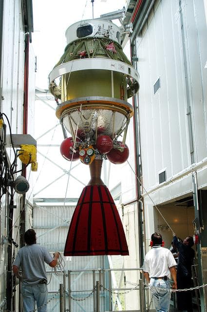 NASA image: KENNEDY SPACE CENTER, FLA. - The second stage of a Delta II rocket is moved into position at the top of the launch tower on Pad 17-B, Cape Canaveral Air Force Station.  It will be mated to the Delta first stage already at the pad in preparation for the launch of the Mars Exploration Rover-1 (MER-B) on June 25.  NASA’s twin Mars Exploration Rovers are designed to study the history of water on Mars. These robotic geologists are equipped with a robotic arm, a drilling tool, three spectrometers, and four pairs of cameras that allow them to have a human-like, 3D view of the terrain. Each rover could travel as far as 100 meters in one day to act as Mars scientists' eyes and hands, exploring an environment where humans are not yet able to go. The launch of MER-2 (MER-A) is tentatively set for June 8.