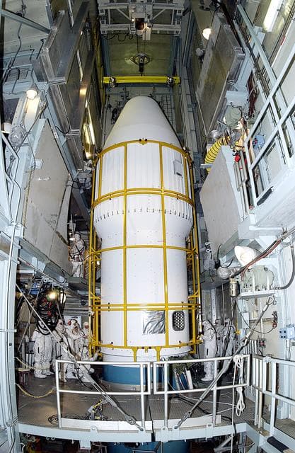 NASA image: KENNEDY SPACE CENTER, FLA. -  The two halves of the fairing come together around the Mars Exploration Rover 2 (MER-2) on Launch Complex 17-A, Cape Canaveral Air Force Station.  MER-2 is one of NASA's twin Mars Exploration Rovers designed to study the history of water on Mars. These robotic geologists are equipped with a robotic arm, a drilling tool, three spectrometers, and four pairs of cameras that allow them to have a human-like, 3D view of the terrain. Each rover could travel as far as 100 meters in one day to act as Mars scientists' eyes and hands, exploring an environment where humans can't yet go.  MER-2 is scheduled to launch no earlier than June 8, 2003, as MER-A, with two launch opportunities each day during the launch period that closes on June 19.