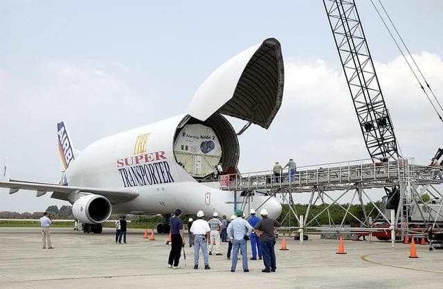 NASA image: KENNEDY SPACE CENTER, FLA. - The Italian-built module, U.S. Node 2, for the International Space Station is offloaded from a Beluga at the Shuttle Landing Facility. The second of three Station connecting modules, Node 2 attaches to the end of the U.S. Lab and provides attach locations for the Japanese laboratory, European laboratory, the Centrifuge Accommodation Module and, later, Multipurpose Logistics Modules. It will provide the primary docking location for the Shuttle when a pressurized mating adapter is attached to Node 2.  Installation of the module will complete  the U.S. Core of the ISS.  Node 2 is the designated payload for mission STS-120.  No orbiter or launch date has been determined yet.