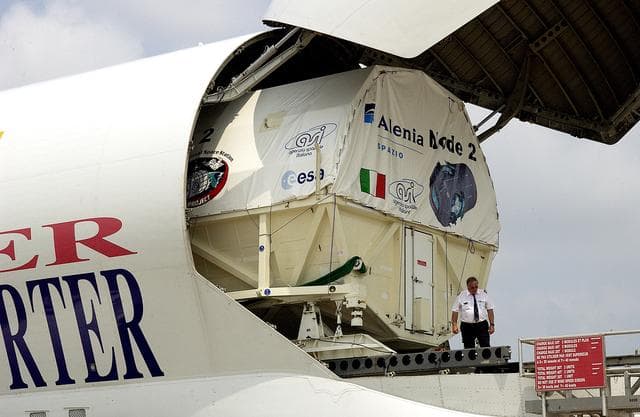 NASA image: KENNEDY SPACE CENTER, FLA. - The Italian-built module, U.S. Node 2, for the International Space Station is offloaded from a Beluga at the Shuttle Landing Facility. The second of three Station connecting modules, Node 2 attaches to the end of the U.S. Lab and provides attach locations for the Japanese laboratory, European laboratory, the Centrifuge Accommodation Module and, later, Multipurpose Logistics Modules. It will provide the primary docking location for the Shuttle when a pressurized mating adapter is attached to Node 2.  Installation of the module will complete  the U.S. Core of the ISS.  Node 2 is the designated payload for mission STS-120.  No orbiter or launch date has been determined yet.