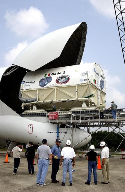 NASA image: KENNEDY SPACE CENTER, FLA. - The Italian-built module, U.S. Node 2, for the International Space Station is offloaded from a Beluga aircraft at the Shuttle Landing Facility.  The second of three Station connecting modules, Node 2 attaches to the end of the U.S. Lab and provides attach locations for the Japanese laboratory, European laboratory, the Centrifuge Accommodation Module and, later, Multipurpose Logistics Modules. It will provide the primary docking location for the Shuttle when a pressurized mating adapter is attached to Node 2.  Installation of the module will complete  the U.S. Core of the ISS.  Node 2 is the designated payload for mission STS-120.  No orbiter or launch date has been determined yet.