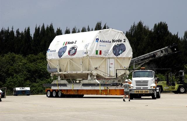 NASA image: KENNEDY SPACE CENTER, FLA. -  The Italian-built module, U.S. Node 2, begins its transfer from  the Shuttle Landing Facility to the Space Station Processing Facility.  The second of three connecting modules on the International Space Station, Node 2 attaches to the end of the U.S. Lab and provides attach locations for the Japanese laboratory, European laboratory, the Centrifuge Accommodation Module and, later, Multipurpose Logistics Modules. It will provide the primary docking location for the Shuttle when a pressurized mating adapter is attached to Node 2.  Installation of the module will complete  the U.S. Core of the ISS.  Node 2 is the designated payload for mission STS-120.  No orbiter or launch date has been determined yet.