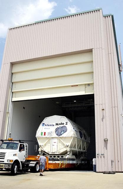 NASA image: KENNEDY SPACE CENTER, FLA. -  The Italian-built module, U.S. Node 2, is moved into the Space Station Processing Facility. The second of three connecting modules on the International Space Station, Node 2 attaches to the end of the U.S. Lab and provides attach locations for the Japanese laboratory, European laboratory, the Centrifuge Accommodation Module and, later, Multipurpose Logistics Modules. It will provide the primary docking location for the Shuttle when a pressurized mating adapter is attached to Node 2.  Installation of the module will complete  the U.S. Core of the ISS.  Node 2 is the designated payload for mission STS-120.  No orbiter or launch date has been determined yet.