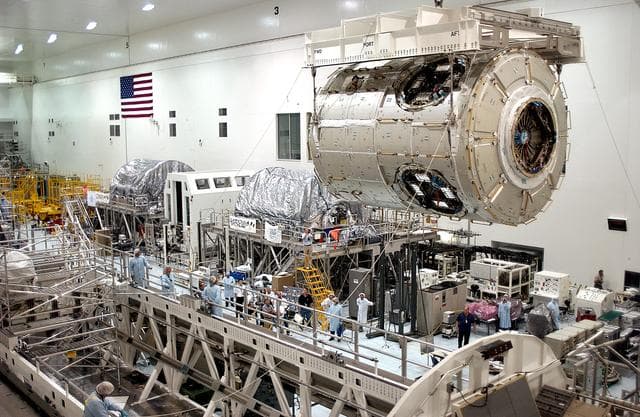 NASA image: KENNEDY SPACE CENTER, FLA. - The U.S. Node 2 is moved toward a workstand in the Space Station Processing Facility.  The second of three connecting modules on the International Space Station, the Italian-built Node 2 attaches to the end of the U.S. Lab and provides attach locations for the Japanese laboratory, European laboratory, the Centrifuge Accommodation Module and, later, Multipurpose Logistics Modules. It will provide the primary docking location for the Shuttle when a pressurized mating adapter is attached to Node 2.  Installation of the module will complete  the U.S. Core of the ISS.  Node 2 is the designated payload for mission STS-120.  No orbiter or launch date has been determined yet.