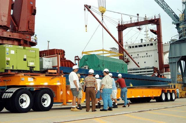 NASA image: KENNEDY SPACE CENTER, FLA. -  At Port Canaveral, the Pressurized Module of the Japanese Experiment Module (JEM) is lowered onto a truck bed.  The container transport ship carrying JEM departed May 2 from Yokohama Harbor in Japan for the voyage to the United States. The National Space Development Agency of Japan (NASDA) developed the laboratory at the Tsukuba Space Center near Tokyo. The Pressurized Module is the first element of the JEM, named "Kibo" (Hope), to be delivered to KSC and will be transferred to the Space Station Processing Facility. The JEM is Japan's primary contribution to the Station. It will enhance the unique research capabilities of the orbiting complex by providing an additional environment for astronauts to conduct science experiments.  The JEM also includes an exposed facility (platform) for space environment experiments, a robotic manipulator system, and two logistics modules. The various JEM components will be  assembled in space over the course of three Shuttle missions.