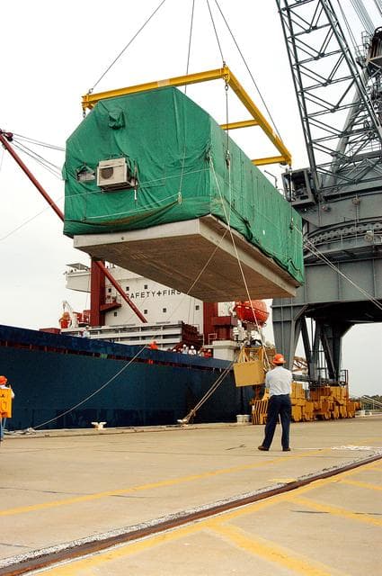 NASA image: KENNEDY SPACE CENTER, FLA. - At Port Canaveral, the Pressurized Module of the Japanese Experiment Module (JEM) is suspended over the dock, waiting for a truck that will transfer it to KSC’s Space Station Processing Facility. The container transport ship carrying JEM departed May 2 from Yokohama Harbor in Japan for the voyage to the United States. The National Space Development Agency of Japan (NASDA) developed the laboratory at the Tsukuba Space Center near Tokyo.  The Pressurized Module is the first element of the JEM, named "Kibo" (Hope), to be delivered to KSC. The JEM is Japan's primary contribution to the Station. It will enhance the unique research capabilities of the orbiting complex by providing an additional environment for astronauts to conduct science experiments.  The JEM also includes an exposed facility (platform) for space environment experiments, a robotic manipulator system, and two logistics modules. The various JEM components will be  assembled in space over the course of three Shuttle missions.