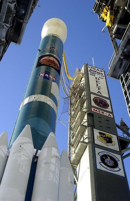 NASA image: KENNEDY SPACE CENTER, FLA. -  The Mobile Service Tower is rolled back at Launch Complex 17A to reveal a Delta II rocket ready to launch the Mars Exploration Rover-A mission.  NASA's twin Mars Exploration Rovers are designed to study the history of water on Mars. These robotic geologists are equipped with a robotic arm, a drilling tool, three spectrometers, and four pairs of cameras that allow them to have a human-like, 3D view of the terrain. Each rover could travel as far as 100 meters in one day to act as Mars scientists' eyes and hands, exploring an environment where humans are not yet able to go. MER-A, with the rover Spirit aboard, is scheduled to launch on June 8 at 2:06 p.m. EDT, with two launch opportunities each day during a launch period that closes on June 24.