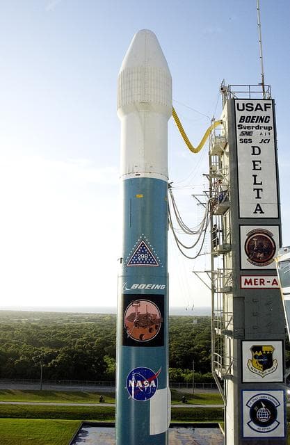 NASA image: KENNEDY SPACE CENTER, FLA. -  The Mobile Service Tower is rolled back at Launch Complex 17A to reveal a Delta II rocket ready to launch the Mars Exploration Rover-A mission.  NASA's twin Mars Exploration Rovers are designed to study the history of water on Mars. These robotic geologists are equipped with a robotic arm, a drilling tool, three spectrometers, and four pairs of cameras that allow them to have a human-like, 3D view of the terrain. Each rover could travel as far as 100 meters in one day to act as Mars scientists' eyes and hands, exploring an environment where humans are not yet able to go. MER-A, with the rover Spirit aboard, is scheduled to launch on June 8 at 2:06 p.m. EDT, with two launch opportunities each day during a launch period that closes on June 24.