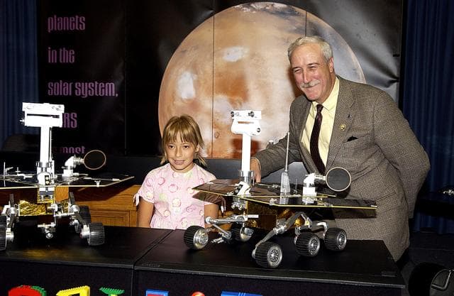 NASA image: KENNEDY SPACE CENTER, FLA. -  Nine-year-old Sofi Collis (left) is introduced to the media by NASA Administrator Sean O'Keefe at a press conference.   The Siberian-born Arizona resident wrote the winning entry in the Name the Rovers Contest sponsored by NASA and the Lego Co., a Denmark-based toymaker, with collaboration from the Planetary Society, Pasadena, Calif.  The names she selected for the Mars Exploration Rovers are "Spirit" and "Opportunity." The third grader's essay was chosen from more than 10,000 American student entries.  NASA's twin Mars Exploration Rovers are designed to study the history of water on Mars. These robotic geologists are equipped with a robotic arm, a drilling tool, three spectrometers, and four pairs of cameras that allow them to have a human-like, 3D view of the terrain. Each rover could travel as far as 100 meters in one day to act as Mars scientists' eyes and hands, exploring an environment where humans are not yet able to go. MER-A, with the rover Spirit aboard, is scheduled to launch on June 8 at 2:06 p.m. EDT, with two launch opportunities each day during a launch period that closes on June 24.