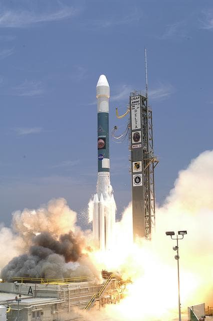 NASA image: KENNEDY SPACE CENTER, FLA. - Amid billows of smoke and steam, the Delta II rocket with its Mars Exploration Rover (MER-A) payload lifts off the pad on time at 1:58 p.m. EDT from Launch Complex 17-A, Cape Canaveral Air Force Station. MER-A, known as "Spirit," is the first of two rovers being launched to Mars. When the two rovers arrive at the red planet in 2004, they will bounce to airbag-cushioned landings at sites offering a balance of favorable conditions for safe landings and interesting science. The rovers see sharper images, can explore farther and examine rocks better than anything that has ever landed on Mars. The designated site for the MER-A mission is Gusev Crater, which appears to have been a crater lake. The second rover, MER-B, is scheduled to launch June 25.