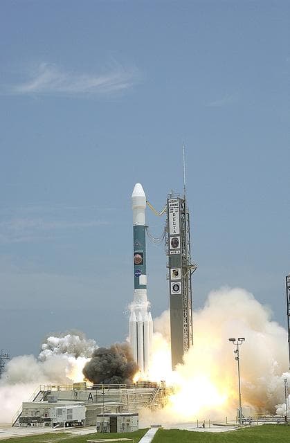 NASA image: KENNEDY SPACE CENTER, FLA. - Blue sky and sun give a dramatic backdrop for the launch of  the Delta II rocket with its Mars Exploration Rover (MER-A) payload.  Liftoff occurred on time at 1:58 p.m. EDT from Launch Complex 17-A, Cape Canaveral Air Force Station. MER-A, known as "Spirit," is the first of two rovers being launched to Mars. When the two rovers arrive at the red planet in 2004, they will bounce to airbag-cushioned landings at sites offering a balance of favorable conditions for safe landings and interesting science. The rovers see sharper images, can explore farther and examine rocks better than anything that has ever landed on Mars. The designated site for the MER-A mission is Gusev Crater, which appears to have been a crater lake. The second rover, MER-B, is scheduled to launch June 25.