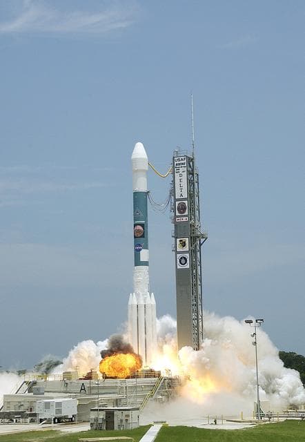 NASA image: KENNEDY SPACE CENTER, FLA. -  The Delta II rocket with its Mars Exploration Rover (MER-A) payload leaps off the launch pad into the blue sky to begin its journey to Mars.  Liftoff occurred on time at 1:58 p.m. EDT from Launch Complex 17-A, Cape Canaveral Air Force Station.  MER-A, known as "Spirit," is the first of two rovers being launched to Mars. When the two rovers arrive at the red planet in 2004, they will bounce to airbag-cushioned landings at sites offering a balance of favorable conditions for safe landings and interesting science. The rovers see sharper images, can explore farther and examine rocks better than anything that has ever landed on Mars. The designated site for the MER-A mission is Gusev Crater, which appears to have been a crater lake. The second rover, MER-B, is scheduled to launch June 25.