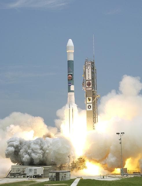 NASA image: KENNEDY SPACE CENTER, FLA. -  The Delta II rocket with its Mars Exploration Rover (MER-A) payload leaps off the launch pad into the blue sky to begin its journey to Mars.  Liftoff occurred on time at 1:58 p.m. EDT from Launch Complex 17-A, Cape Canaveral Air Force Station.  MER-A, known as "Spirit," is the first of two rovers being launched to Mars. When the two rovers arrive at the red planet in 2004, they will bounce to airbag-cushioned landings at sites offering a balance of favorable conditions for safe landings and interesting science. The rovers see sharper images, can explore farther and examine rocks better than anything that has ever landed on Mars. The designated site for the MER-A mission is Gusev Crater, which appears to have been a crater lake. The second rover, MER-B, is scheduled to launch June 25.