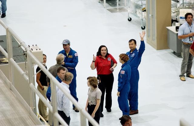 KENNEDY SPACE CENTER, FLA. -    Members of the STS-114 crew take a look at the Japanese Experiment Module (JEM) pressure module in the Space Station Processing Facility.  A research laboratory, the pressurized module is the first element of the JEM, named "Kibo" (Hope), to be delivered to KSC.   The National Space Development Agency of Japan (NASDA) developed the laboratory at the Tsukuba Space Center near Tokyo and is Japan's primary contribution to the Station. The JEM also includes an exposed facility (platform) for space environment experiments, a robotic manipulator system, and two logistics modules. The various JEM components will be  assembled in space over the course of three Shuttle missions.