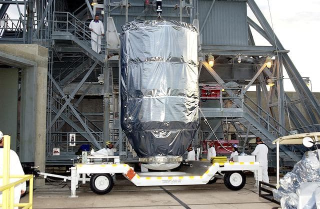 NASA image: KENNEDY SPACE CENTER, FLA. - The Mars Exploration Rover 1 (MER-B) arrives at Launch Pad 17-B, Cape Canaveral Air Force Station, where it will be mated with the Delta rocket for launch.  The second of twin rovers being sent to Mars, it is equipped with a robotic arm, a drilling tool, three spectrometers, and four pairs of cameras that allow it to have a human-like, 3D view of the terrain. Each rover could travel as far as 100 meters in one day to act as Mars scientists' eyes and hands, exploring an environment where humans can't yet go.  MER-B is scheduled to launch June 26 at one of two available times,  12:27:31 a.m. EDT or 1:08:45 a.m. EDT.