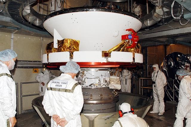 NASA image: KENNEDY SPACE CENTER, FLA. -    In the gantry on Launch Complex 17-B, Cape Canaveral Air Force Station, Mars Exploration Rover 1 (MER-B) is revealed after removal of the canister.  The second of twin rovers being sent to Mars, it is equipped with a robotic arm, a drilling tool, three spectrometers, and four pairs of cameras that allow it to have a human-like, 3D view of the terrain. Each rover could travel as far as 100 meters in one day to act as Mars scientists' eyes and hands, exploring an environment where humans can't yet go.  MER-B is scheduled to launch June 26 at one of two available times,  12:27:31 a.m. EDT or 1:08:45 a.m. EDT.