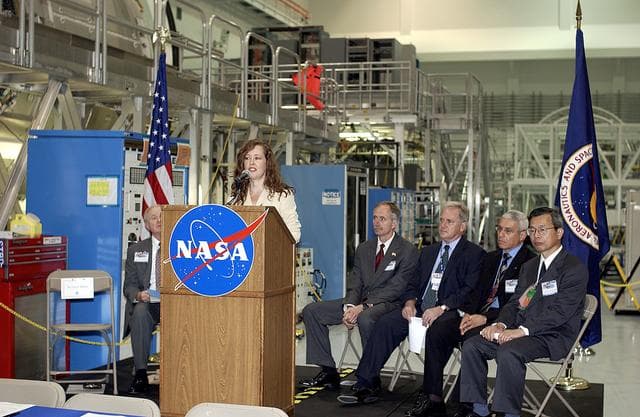 KENNEDY SPACE CENTER, FLA. -   Lisa Malone, deputy director of External Relations and Business Development at KSC, emcees a ceremony in the Space Station Processing Facility to highlight the arrival of two major components of the International Space Station.  NASA's Node 2, built by the European Space Agency (ESA) in Italy arrived at KSC on June 1. It will be the next pressurized module installed on the Station. The pressurized module of the Japanese Experiment Module (JEM), named "Kibo" (Hope) arrived at KSC on June 4. It is Japan's primary contribution to the Station. The ceremony held today included the official transfer of ownership signing of Node 2 between the ESA and NASA..  Speakers at the ceremony included KSC Director Roy Bridges Jr.; NASA's Michael C. Kostelnik, deputy associate administrator for International Space Station and Shuttle Programs, and William Gerstenmaier, International Space Station Program manager; Alan Thirkettle, International Space Station Program manager for Node 2, ESA; Andrea Lorenzoni, International Space Station Program manager for Node 2, Italian Space Agency; Kuniaki Shiraki, JEM Project manager, National Aerospace and Development Agency of Japan.