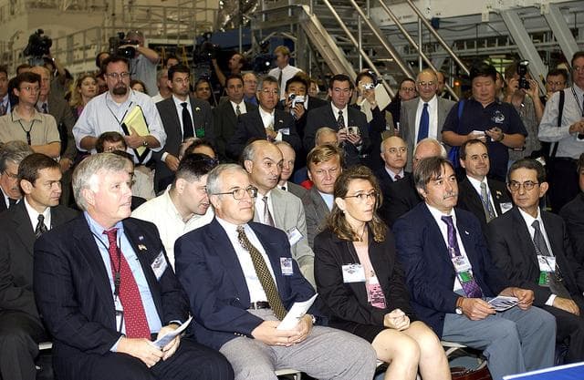 KENNEDY SPACE CENTER, FLA. -  In the Space Station Processing Facility, media and guests listen intently to remarks during a ceremony to highlight the arrival of two major components of the International Space Station.  NASA's Node 2, built by the European Space Agency (ESA) in Italy arrived at KSC on June 1. It will be the next pressurized module installed on the Station. The pressurized module of the Japanese Experiment Module (JEM), named "Kibo" (Hope) arrived at KSC on June 4. It is Japan's primary contribution to the Station. The ceremony held today included the official transfer of ownership signing of Node 2 between the ESA and NASA.. Emceed by Lisa Malone,  deputy director of External Relations and Business Development at KSC, the ceremony included these speakers: KSC Director Roy Bridges Jr.; NASA's Michael C. Kostelnik, deputy associate administrator for International Space Station and Shuttle Programs, and William Gerstenmaier, International Space Station Program manager; Alan Thirkettle, International Space Station Program manager for Node 2, ESA; Andrea Lorenzoni, International Space Station Program manager for Node 2, Italian Space Agency; Kuniaki Shiraki, JEM Project manager, National Aerospace and Development Agency of Japan.