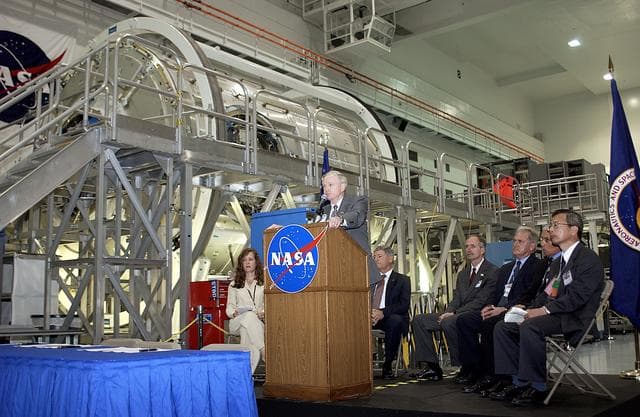 NASA image: KENNEDY SPACE CENTER, FLA. -  Center Director Roy Bridges Jr. speaks to the media and guests gathered in the Space Station Processing Facility for a ceremony to highlight the arrival of two major components of the International Space Station.  NASA's Node 2, built by the European Space Agency (ESA) in Italy arrived at KSC on June 1. It will be the next pressurized module installed on the Station. The pressurized module of the Japanese Experiment Module (JEM), named "Kibo" (Hope) arrived at KSC on June 4. It is Japan's primary contribution to the Station. The ceremony held today included the official transfer of ownership signing of Node 2 between the ESA and NASA.. Emceed by Lisa Malone (left),  deputy director of External Relations and Business Development at KSC, the ceremony also included these speakers: NASA's Michael C. Kostelnik, deputy associate administrator for International Space Station and Shuttle Programs, and William Gerstenmaier, International Space Station Program manager; Alan Thirkettle, International Space Station Program manager for Node 2, ESA; Andrea Lorenzoni, International Space Station Program manager for Node 2, Italian Space Agency; Kuniaki Shiraki, JEM Project manager, National Aerospace and Development Agency of Japan.