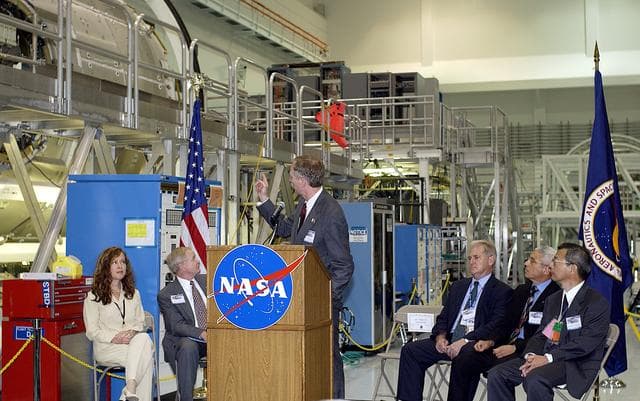 NASA image: KENNEDY SPACE CENTER, FLA. -   At a ceremony highlighting the arrival of two major components of the International Space Station, William Gerstenmaier, International Space Station Program manager, points to one of the components as he speaks to guests and the media gathered in the Space Station Processing Facility.  NASA's Node 2, built by the European Space Agency (ESA) in Italy, arrived at KSC on June 1. It will be the next pressurized module installed on the Station. The pressurized module of the Japanese Experiment Module (JEM), named "Kibo" (Hope), arrived at KSC on June 4. It is Japan's primary contribution to the Station. The ceremony held today included the official transfer of ownership signing of Node 2 between the ESA and NASA.. Emceed by Lisa Malone, deputy director of External Relations and Business Development at KSC, the ceremony also included these speakers: Center Director Roy Bridges Jr.; NASA’s Michael C. Kostelnik, deputy associate administrator for International Space Station and Shuttle Programs; Alan Thirkettle, International Space Station Program manager for Node 2, ESA; Andrea Lorenzoni, International Space Station Program manager for Node 2, Italian Space Agency; and Kuniaki Shiraki, JEM Project manager, National Aerospace and Development Agency of Japan.