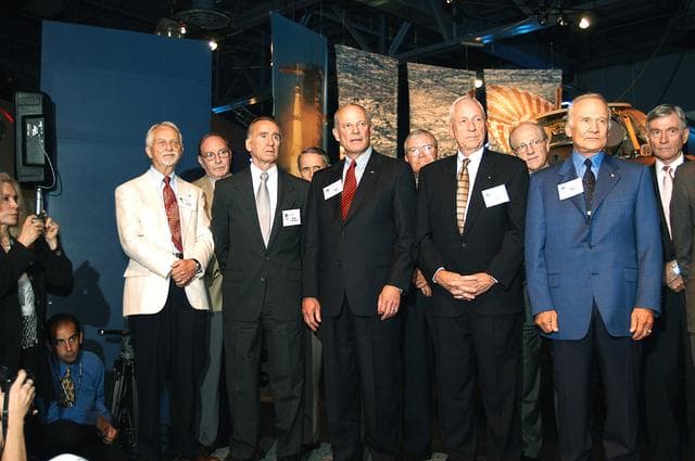 NASA image: KENNEDY SPACE CENTER, FLA. -  A group of current and former U.S. astronauts are introduced to the audience at a ribbon cutting ceremony officially opening the U.S. Astronaut Hall of Fame as part of the Kennedy Space Center Visitor Complex.  In the front row, from left, are Owen K. Garriott, Walter Cunningham, Jack R. Lousma, Alfred M. Worden, and Buzz Aldrin.  In the back row, from left, are Edgar D. Mitchell, Edward G. Gibson, Fred W. Haise, Frederick H. (Rick) Hauck, and John W. Young.  The ceremony was held in conjunction with the induction of four Space Shuttle astronauts into the Hall of Fame including Daniel Brandenstein, Robert "Hoot" Gibson, Story Musgrave, and Sally Ride.  Conceived by six of the Mercury Program astronauts, the U.S. Astronaut Hall of Fame opened in 1990 to provide a place where space travelers could be remembered for their participation and accomplishments in the U.S. space program.  The four new inductees join 48 previously honored astronauts from the ranks of the Gemini, Apollo, Skylab, Apollo-Soyuz, and Space Shuttle programs.