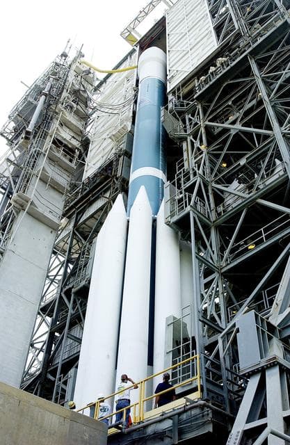 NASA image: KENNEDY SPACE CENTER, FLA. -  The Mobile Service Tower is rolled back at Space Launch Complex 17B, Cape Canaveral Air Force Station, to reveal the Delta II Heavy launch vehicle ready for launch of the Mars Exploration Rover-B (MER-B) mission, with the rover "Opportunity" aboard. The second of twin rovers being sent to Mars, it is equipped with a robotic arm, a drilling tool, three spectrometers, and four pairs of cameras that allow it to have a human-like, 3D view of the terrain. Each rover could travel as far as 100 meters in one day to act as Mars scientists' eyes and hands, exploring an environment where humans are not yet able to go. MER-B is scheduled to launch on June 28 at one of two available times, 11:56:16 p.m. EDT or 12:37:59 a.m. EDT on June 29.