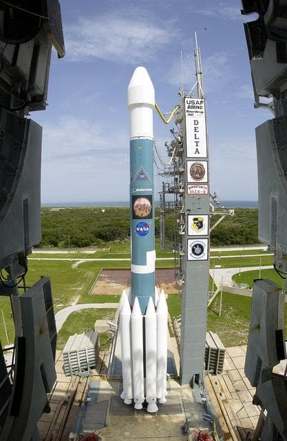 NASA image: KENNEDY SPACE CENTER, FLA. -  The Mobile Service Tower is rolled back at Space Launch Complex 17B, Cape Canaveral Air Force Station, to reveal the Delta II Heavy launch vehicle ready for launch of the Mars Exploration Rover-B (MER-B) mission, with the rover "Opportunity" aboard. The second of twin rovers being sent to Mars, it is equipped with a robotic arm, a drilling tool, three spectrometers, and four pairs of cameras that allow it to have a human-like, 3D view of the terrain. Each rover could travel as far as 100 meters in one day to act as Mars scientists' eyes and hands, exploring an environment where humans are not yet able to go. MER-B is scheduled to launch on June 28 at one of two available times, 11:56:16 p.m. EDT or 12:37:59 a.m. EDT on June 29.