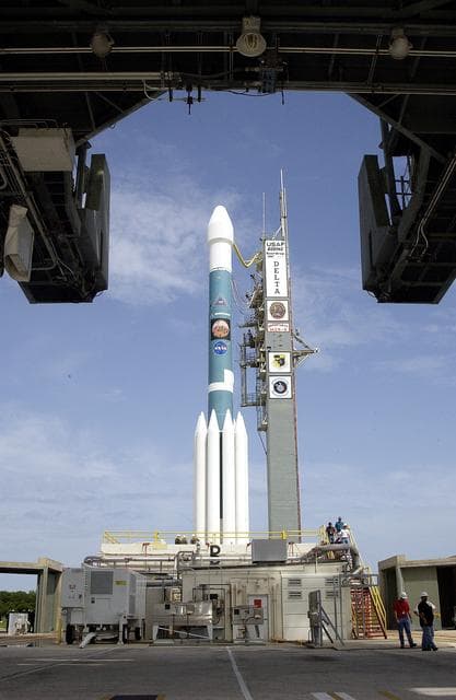 NASA image: KENNEDY SPACE CENTER, FLA. -  The Mobile Service Tower is rolled back at Space Launch Complex 17B, Cape Canaveral Air Force Station, to reveal the Delta II Heavy launch vehicle ready for launch of the Mars Exploration Rover-B (MER-B) mission, with the rover "Opportunity" aboard. The second of twin rovers being sent to Mars, it is equipped with a robotic arm, a drilling tool, three spectrometers, and four pairs of cameras that allow it to have a human-like, 3D view of the terrain. Each rover could travel as far as 100 meters in one day to act as Mars scientists' eyes and hands, exploring an environment where humans are not yet able to go. MER-B is scheduled to launch on June 28 at one of two available times, 11:56:16 p.m. EDT or 12:37:59 a.m. EDT on June 29.