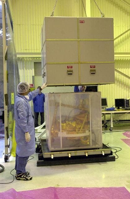 NASA image: KENNEDY SPACE CENTER, FLA. -  The SciSat-1 spacecraft is uncrated at Vandenberg Air Force Base, Calif.  SciSat-1 weighs approximately 330 pounds and will be placed in a 400-mile-high polar orbit to investigate processes that control the distribution of ozone in the upper atmosphere.  The scientific mission of SciSat-1 is to measure and understand the chemical processes that control the distribution of ozone in the Earth’s atmosphere, particularly at high altitudes.  The data from the satellite will provide Canadian and international scientists with improved measurements relating to global ozone processes and help policymakers assess existing environmental policy and develop protective measures for improving the health of our atmosphere, preventing further ozone depletion.  The mission is designed to last two years.