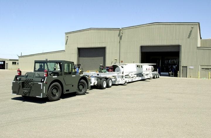 NASA image: KENNEDY SPACE CENTER, FLA. - At Vandenberg Air Force Base, Calif., the Pegasus launch vehicle is moved into its hangar.  The Pegasus will carry the SciSat-1 spacecraft in a 400-mile-high polar orbit to investigate processes that control the distribution of ozone in the upper atmosphere.  The scientific mission of SciSat-1 is to measure and understand the chemical processes that control the distribution of ozone in the Earth’s atmosphere, particularly at high altitudes.  The data from the satellite will provide Canadian and international scientists with improved measurements relating to global ozone processes and help policymakers assess existing environmental policy and develop protective measures for improving the health of our atmosphere, preventing further ozone depletion.  The mission is designed to last two years.
