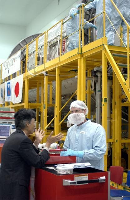 NASA image: KENNEDY SPACE CENTER, FLA. -   STS-115 Mission Specialist Joseph Tanner is dressed in protective gear to enter the Japanese Experiment Module (JEM) Pressurized Module located in the Space Station Processing Facility. Known as Kibo, the JEM consists of six components: two research facilities -- the Pressurized Module and Exposed Facility; a Logistics Module attached to each of them; a Remote Manipulator System; and an Inter-Orbit Communication System unit. Kibo also has a scientific airlock through which experiments are transferred and exposed to the external environment of space. The various components of JEM will be assembled in space over the course of three Space Shuttle missions.  The STS-115 mission will deliver the second port truss segment, the P3/P4 Truss, to attach to the first port truss segment, the P1 Truss, as well as deploy solar array sets 2A and 4A..  The crew is scheduled to activate and check out the Solar Alpha Rotary Joint (SARJ) and deploy the P4 Truss radiator.