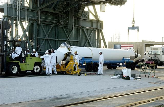 KENNEDY SPACE CENTER, FLA. -   A solid rocket booster (SRB) for the Delta II Heavy rocket that will launch the Space Infrared Telescope Facility (SIRTF) arrives at Launch Complex 17-B, Cape Canaveral Air Force Station.  The Delta II Heavy features nine 46-inch-diameter, stretched SRBs.  Consisting of three cryogenically cooled science instruments and an 0.85-meter telescope, SIRTF is one of NASA's largest infrared telescopes to be launched.  SIRTF will obtain images and spectra by detecting the infrared energy, or heat, radiated by objects in space. Most of this infrared radiation is blocked by the Earth's atmosphere and cannot be observed from the ground.