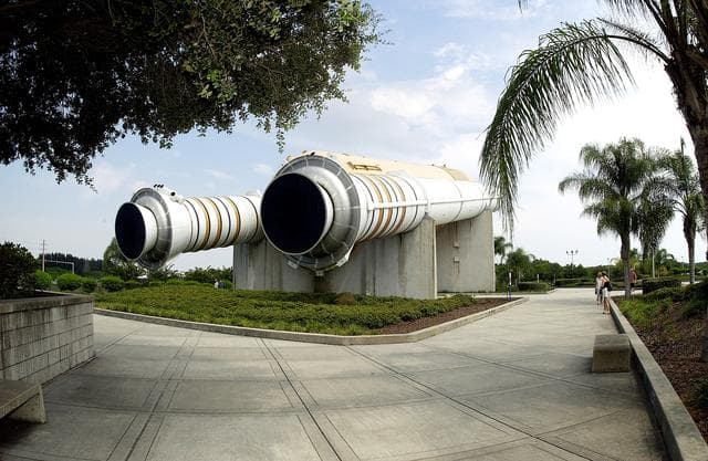 NASA image: KENNEDY SPACE CENTER, FLA.  -  One of the featured displays at the KSC Visitor Complex is a genuine external tank with twin solid rocket boosters, seen here.  The tank and boosters are paired with a full-size replica of a Space Shuttle Orbiter in the Shuttle Plaza.